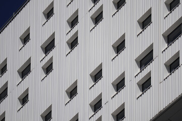 Windows on the facade of the building, in a modern minimalist architectural style