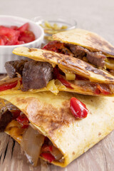 Mexican food. Quesadilla with beef, cheese, sweet pepper and green jalapeno