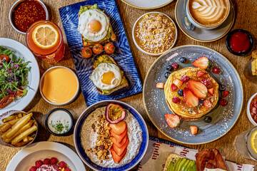 College of Breakfast Assortiment with pancakes, eggs, coffee 