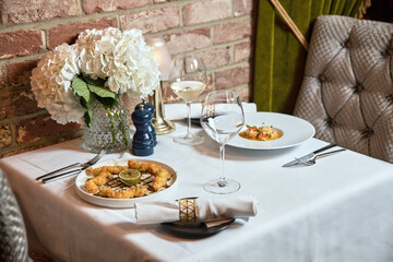 Set for two of seafood for dinner, Grilled shrimps or prawns served with lemon, garlic and sauce