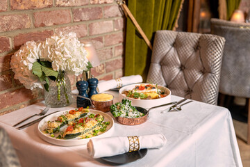 Set for two of seafood for dinner, Grilled shrimps or prawns served with lemon, garlic and sauce