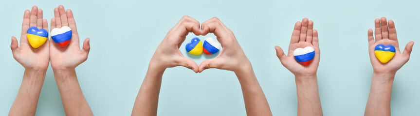 Horizontal banner with children's hands and hearts with flags of the countries of Russia and Ukraine. The geopolitical conflict