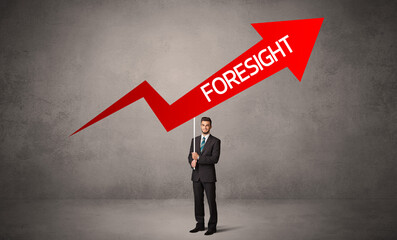 Obraz premium Young business person in casual holding road sign