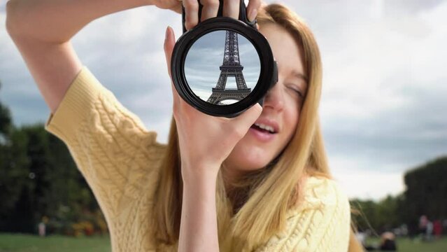 Dream trip to Paris. A girl takes pictures of the Eiffel Tower. Eiffel tower reflection in camera lens