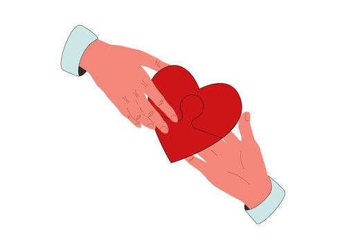 Concept of charity and donation. Give and share your love to people. Several people hold big heart puzzle symbol.