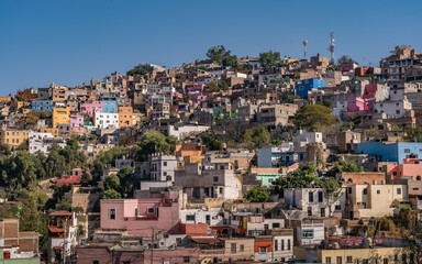 Fototapeta na wymiar Colorful neighborhood on the hillside in the historic city of Guanajuato, Mexico