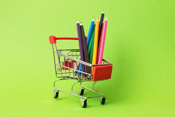 Pile of colored pencils in a shopping cart