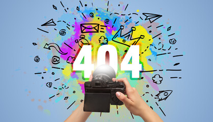 Close-up of a hand holding digital camera with abstract drawing