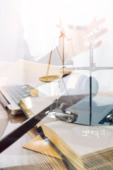 law books and scales of justice on desk in library of law firm. jurisprudence legal education concept.