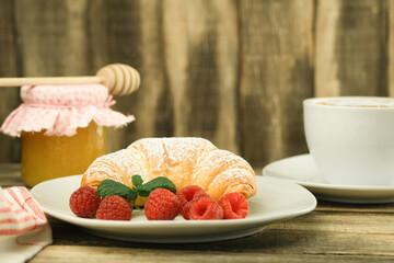 Croissants and fresh raspberries, Fresh and delicious croissants.