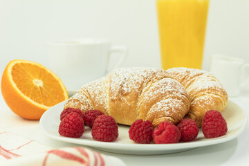 Croissants and fresh raspberries, Fresh and delicious croissants.