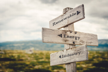 renewable energy industry text quote written in wooden signpost outdoors in nature. Moody theme feeling.