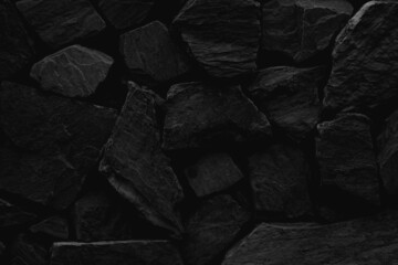 black stone wall texture background.	