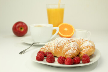 Croissants and fresh raspberries, Fresh and delicious croissants.