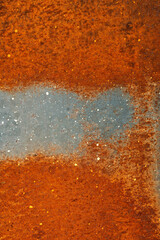 Steel textured metal background sheet with heavy rust. Top view, vertical orientation. Flat lay.