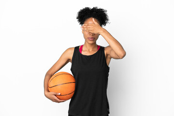 Obraz premium Young basketball player latin woman isolated on white background covering eyes by hands. Do not want to see something