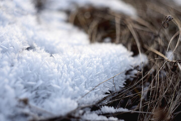 beautiful crystals of frozen snow on the ground
