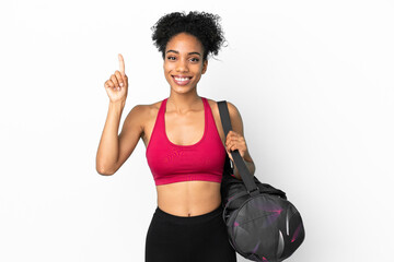 Fototapeta na wymiar Young sport african american woman with sport bag isolated on blue background pointing up a great idea