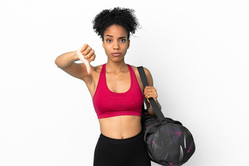 Fototapeta na wymiar Young sport african american woman with sport bag isolated on blue background showing thumb down with negative expression