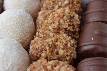 handmade dessert sweets with chocolate, hazelnuts, caramel and walnuts