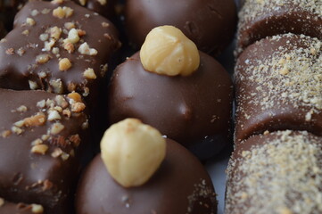 handmade dessert sweets with chocolate, hazelnuts, caramel and walnuts