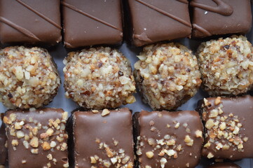 handmade dessert sweets with chocolate, hazelnuts, caramel and walnuts