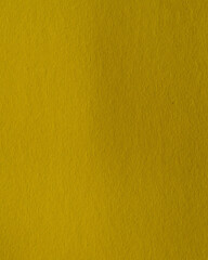 Abstract background made of green-yellow paper. Close-up, paper texture. Yellow-green cardboard close-up-textured paper background. Abstract background made of thick swamp-colored paper