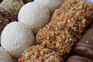 handmade dessert sweets with chocolate, hazelnuts, caramel and walnuts