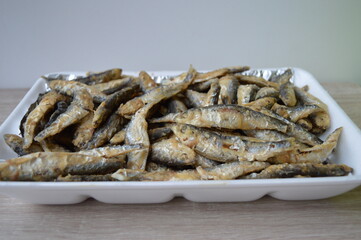 Fried fish Euroropean sprat or sardine, a small and tasty fish caught in the Irish Sea, the Black Sea, the Baltic Sea and the Sea of the Hebrides.