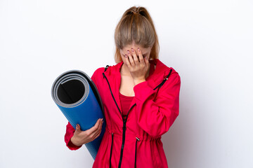 Obraz premium Teenager girl going to yoga classes while holding a mat isolated on white bakcground with tired and sick expression