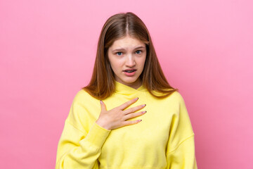 Teenager Russian girl isolated on pink background pointing to oneself