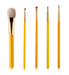 Set of professional makeup concealer powder blush eye shadow eyebrow brushes with yellow handles isolated on white background
