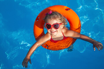 little  girl sunning at the pool