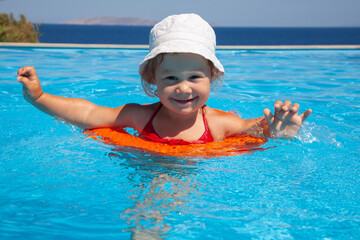 little  girl sunning at the pool