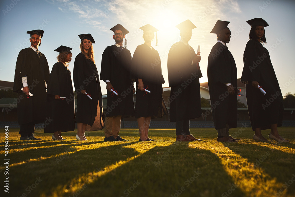 Poster let new adventures begin. shot of a group of university students standing together on graduation day