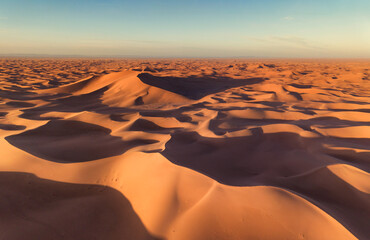Fototapeta na wymiar Aerial view on big sand dunes, landscape in Sahara desert at sunrise