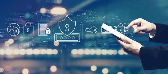 Cyber security theme with businessman using a tablet computer