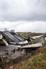 Fototapeta na wymiar Broken bridge over the Trubizh River near the village of Rusaniv, Brovarsky district, Kiev region