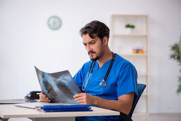 Young male doctor radiologist working in the clinic