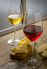 Still life with glass of red and white wine on wooden background, copy space