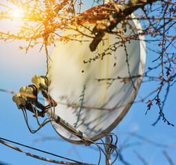 old round satellite dish against the blue sky