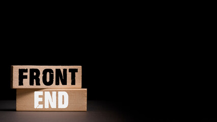 front end concept. wooden blocks with the inscription front-end with a black background.