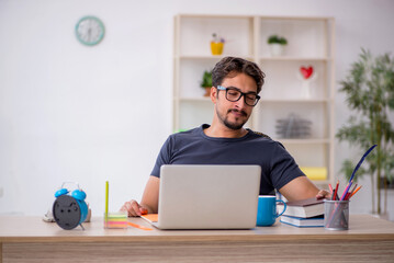 Young male designer working in the office