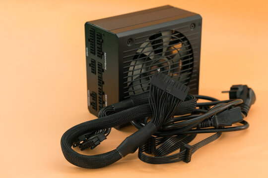 24-pin motherboard power connector pinout wires lays near power supply. Component. Connect. Distribution. Complexity. Many. Curve. Charge. Cooler. Plug. Black. Box. Part. Cooling
