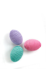 Making Easter eggs from multi-colored threads. Handmade, amigurumi