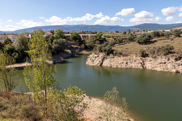 Fototapeta na wymiar Buitrago del Lozoya, Spain. The Lozoya river, as seen from the city walls