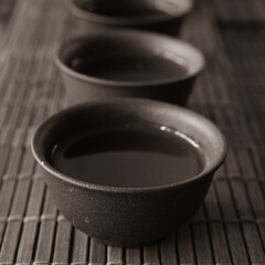 tea set on a table with a bamboo mat