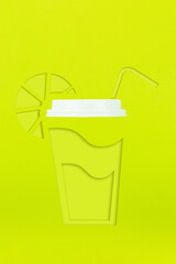 Abstract paper coffee cup, drinking straw and lemon carved from paper in delicate green tones with real Plastic Lid.