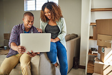 What do you think of this color for the walls. Shot of a cheerful young couple doing online shopping together while being seated on a couch at home.