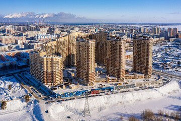 Surgut city in winter. Residential area, city development. Aerial view.